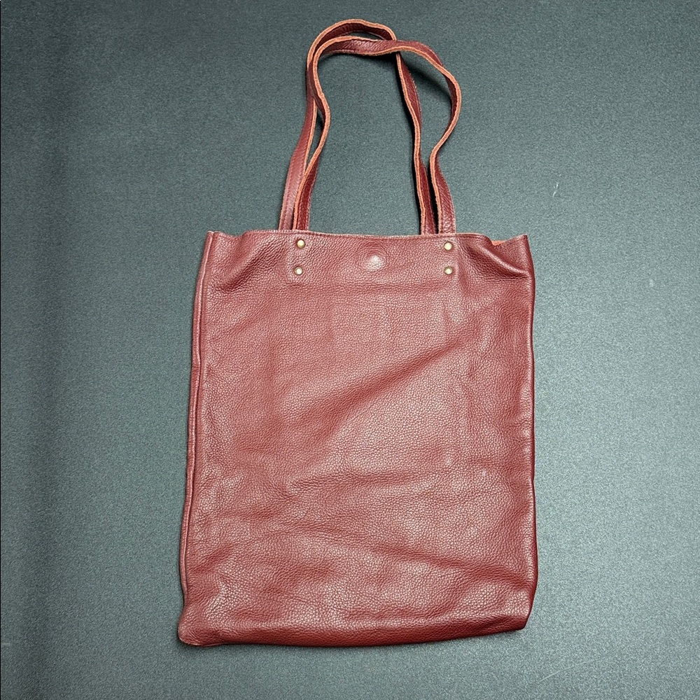 Wine colored boutique leather shoulder bag by Leah Lerner